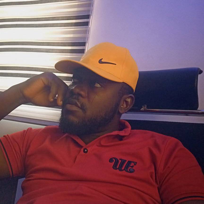 Bernard Okpe in a relaxed professional setting, showcasing work-life balance
